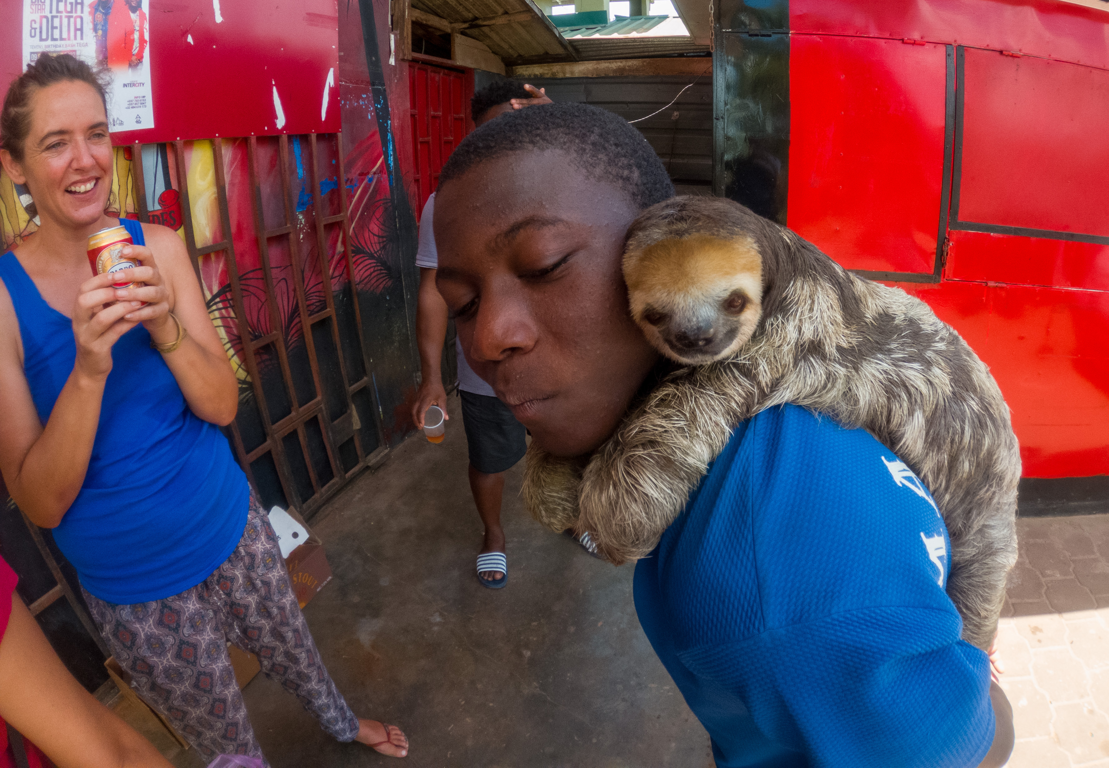 At a stop along the way to Atjoni Merel is fascinated by a boy with a captured sloth.