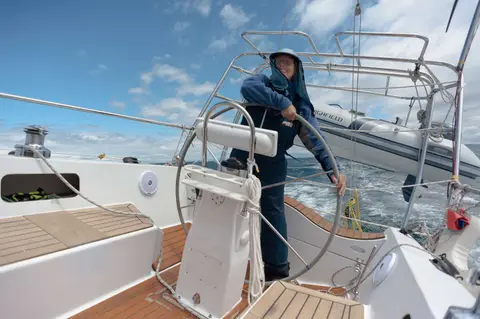 Lesley at the helm running downwind up the east coast of bruny