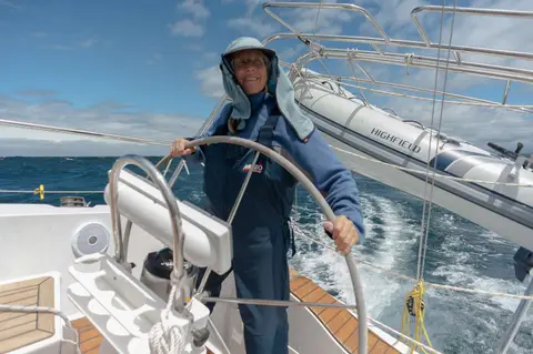 Lesley at the helm running downwind up the east coast of bruny