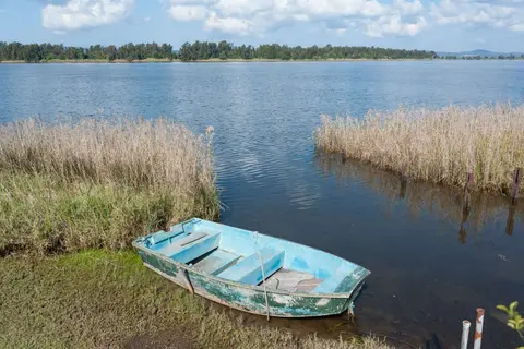 Wooden Dinghy by the River