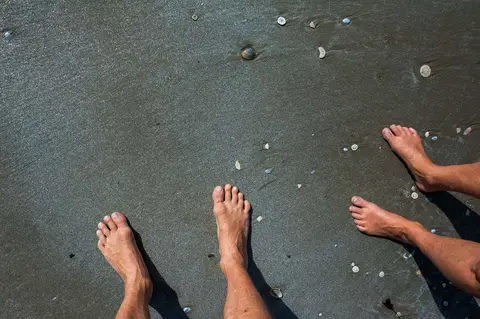 Golden Sand. Gold flakes in the sand of Mulligan Beach Hinchinbrook Island give it a metallic sheen