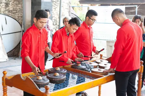 Musicians. Gongs and drums are the only instruments.