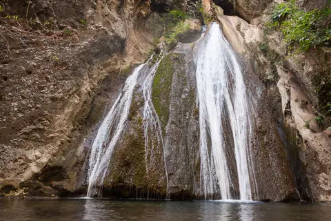 Local Water Source.. Water is captured in a small weir at the bottom of the falls and piped down the valley to the village.