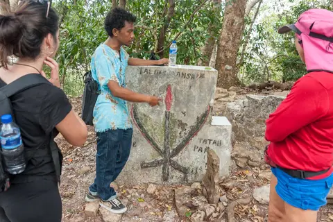 Graves of Two Warriors. They fought for this land so their villagers didn't need to. Both died of their wounds but the local guy lived longer so he won. You can just see the losers grave on the right.
