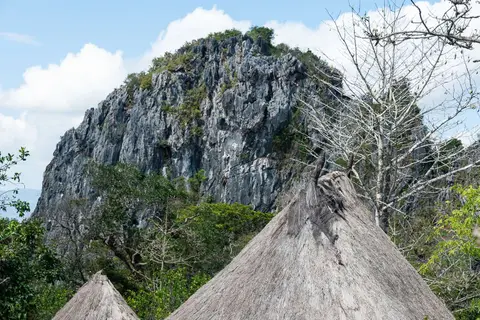 Tamkesi Huts. With sacred hill in the background