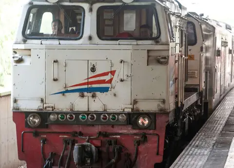 The Train to Bandung. The two young drivers flashed their lights and blasted their horn for show.