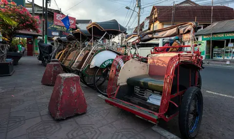 Becaks.. Traditional rickshaws or pedicabs.