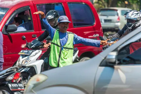 A Dangerous Dance. The traffic police are amazing.