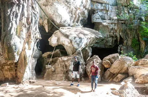 Outside the Entrance to Amboni Caves. Charles on the left and the guide on the right.