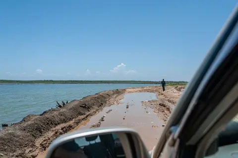George Inspecting the Road. Yes, we made it through!