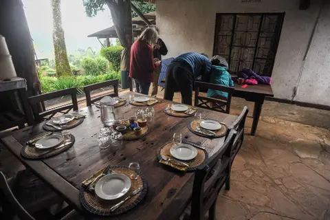Dining. Food from the farm, except meat, and I am standing in front of a big open fire.