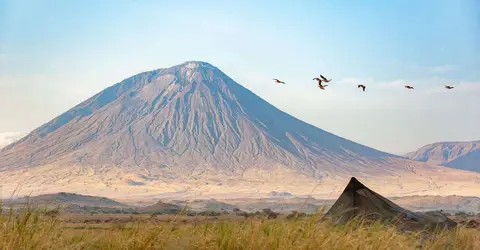 Ol Doinyo Lengai. It is an active volcano that last erupted in 1960.