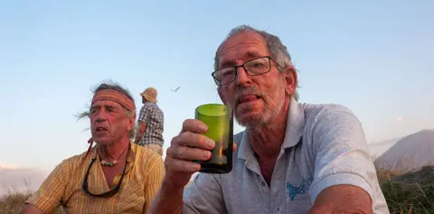 Roy Enjoys a Beer. Our last sundowner at Lake Natron.