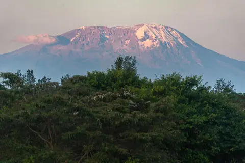 Kilimanjaro at Sunset. Our only view of the summit was from Moshi, 65 km away, on the last day. A rare sight.