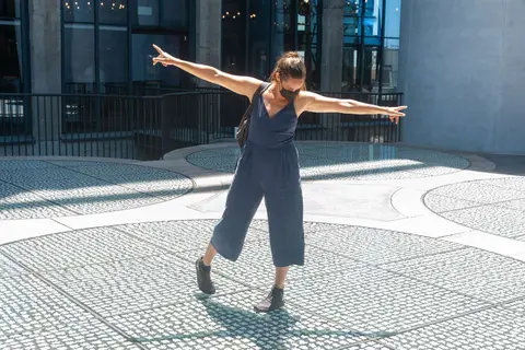 Dancing on the Roof. Merel tests the transparent floor of the MOCCA roof.