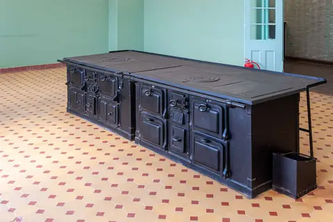 Fabulous Stove. What's missing? The chimney is routed under the floor.