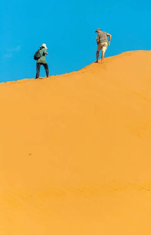 Matt and Jen. Climbing the only accessible dune. The road to Sossusvlei was flooded.