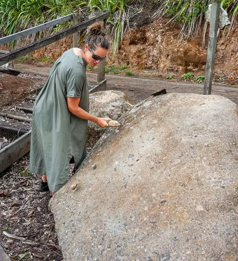Ringing the Bell. The stone rings like a bell when struck.