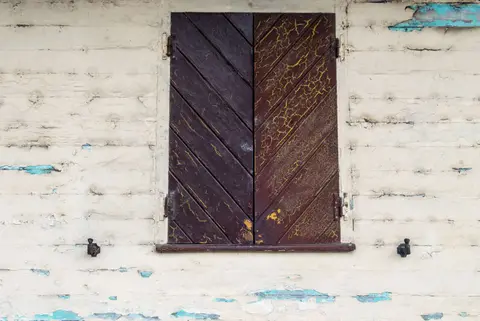 Shutters at the Transportation Camp. Hundred year old woodwork is still functional.