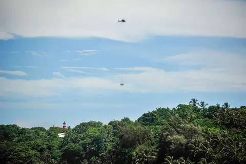 Helicopter. Supplies are brought in by helicopter.