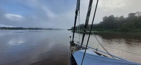 The Suriname River. A deep, fast-flowing river that we followed upstream past Paramaribo, the capital, to Domburg where we anchored.