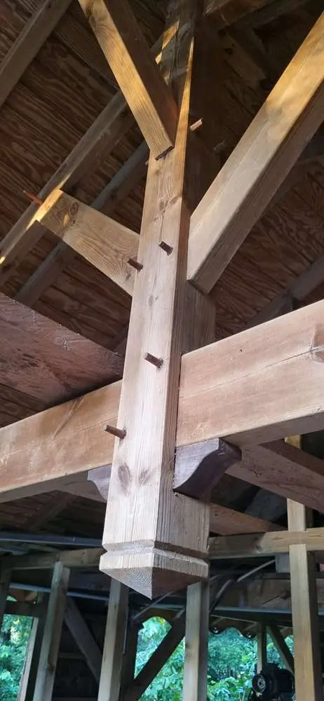 The House that Édouard Built. There are no structural bolts or screws; the timber frame is held together with wooden pegs.