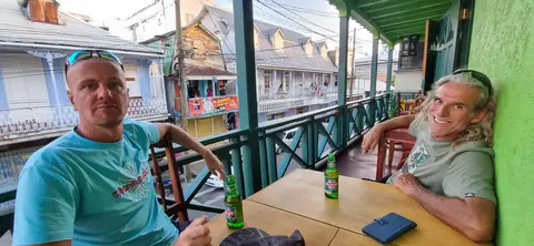 Dominica. Wim and Yayo enjoy a cold beer.