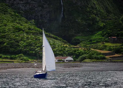 Sapphira leaves Flores. Mark sails Sapphira off the anchor at Fajaa Grande. His motor is out of action.