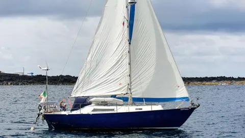 Sapphira on her Way. Mark sails off his anchor, on his way to Horta.