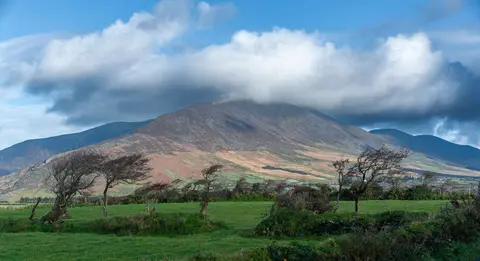Knocknadobar with trees. The trees are a clue to the weather.