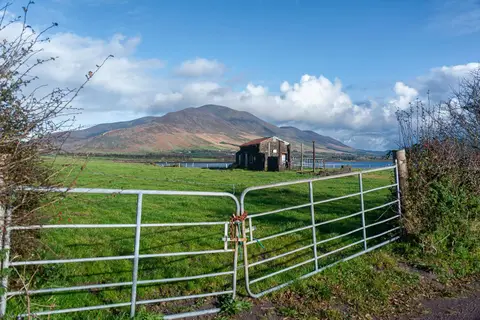 Knocknadobar and gate. The 'hill of the wells'