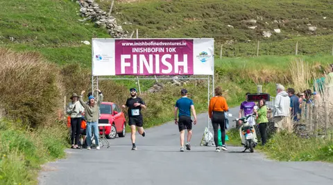 Two-way Finish. 10km runners finished down the hill; half-marathon runners finished going up; and cars came through as they pleased!