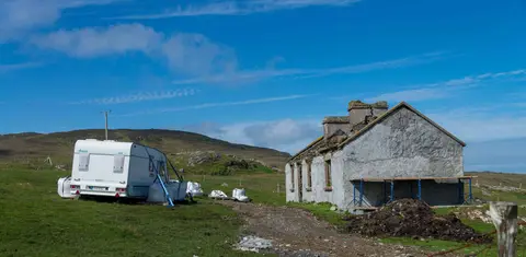 A Fixer-upper. Note the one ton bags holding the caravan down against the Atlantic gales.