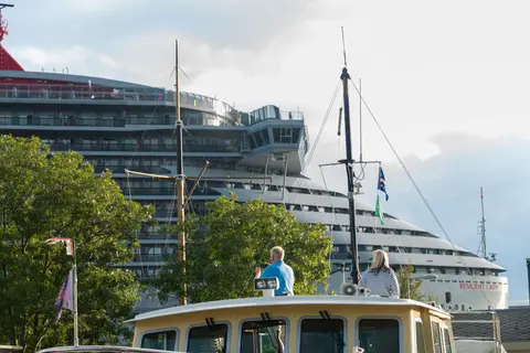 Hard to Believe. The marina residents found it hard to believe a ship that big could navigate the river.