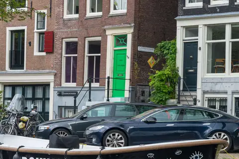 The Green Door. Door colors in Amsterdam must be 'appropriate' and 'approved'. Maybe he was color-blind?
